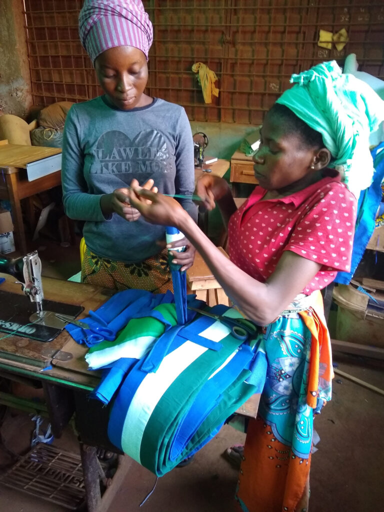two women sewing clothes