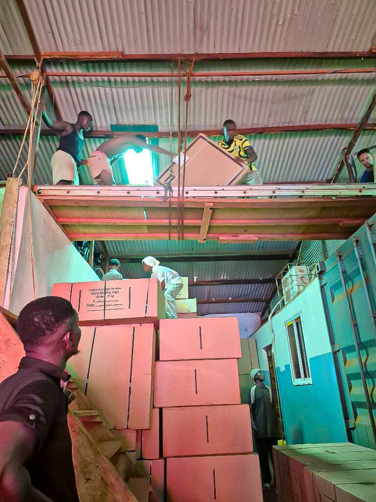 On February 8 one of over 60 bicycles  and one of 70 mobility carts, plus other items, were unloaded from two containers and stored at our Freetown base. We share the location with our local non-profit partner: Orthotic Rehabilitation and Medical Services of Sierra Leone.